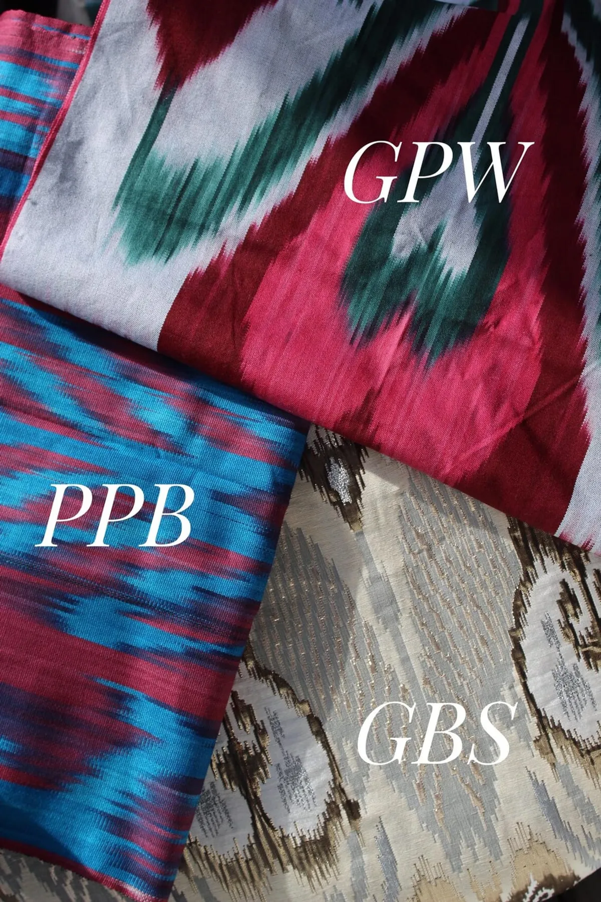 Ikat fabric swatches in maroon-teal-white, blue-pink, and gold brocade colorways
