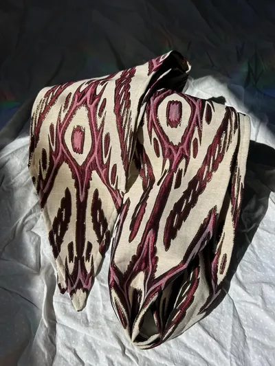 Atlas ikat neck scarf folded over itself showing the diamond ikat pattern