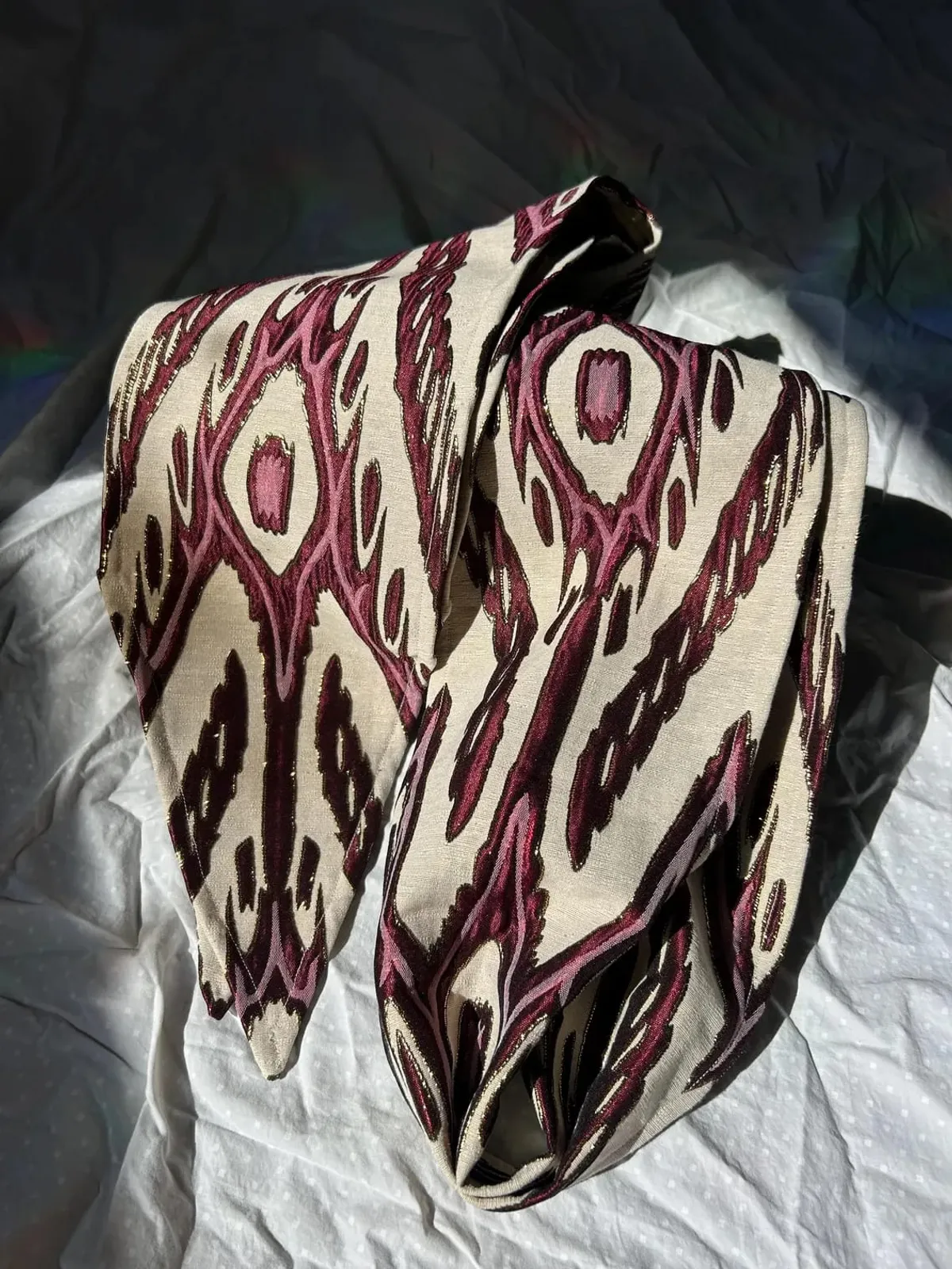 Atlas ikat neck scarf folded over itself showing the diamond ikat pattern