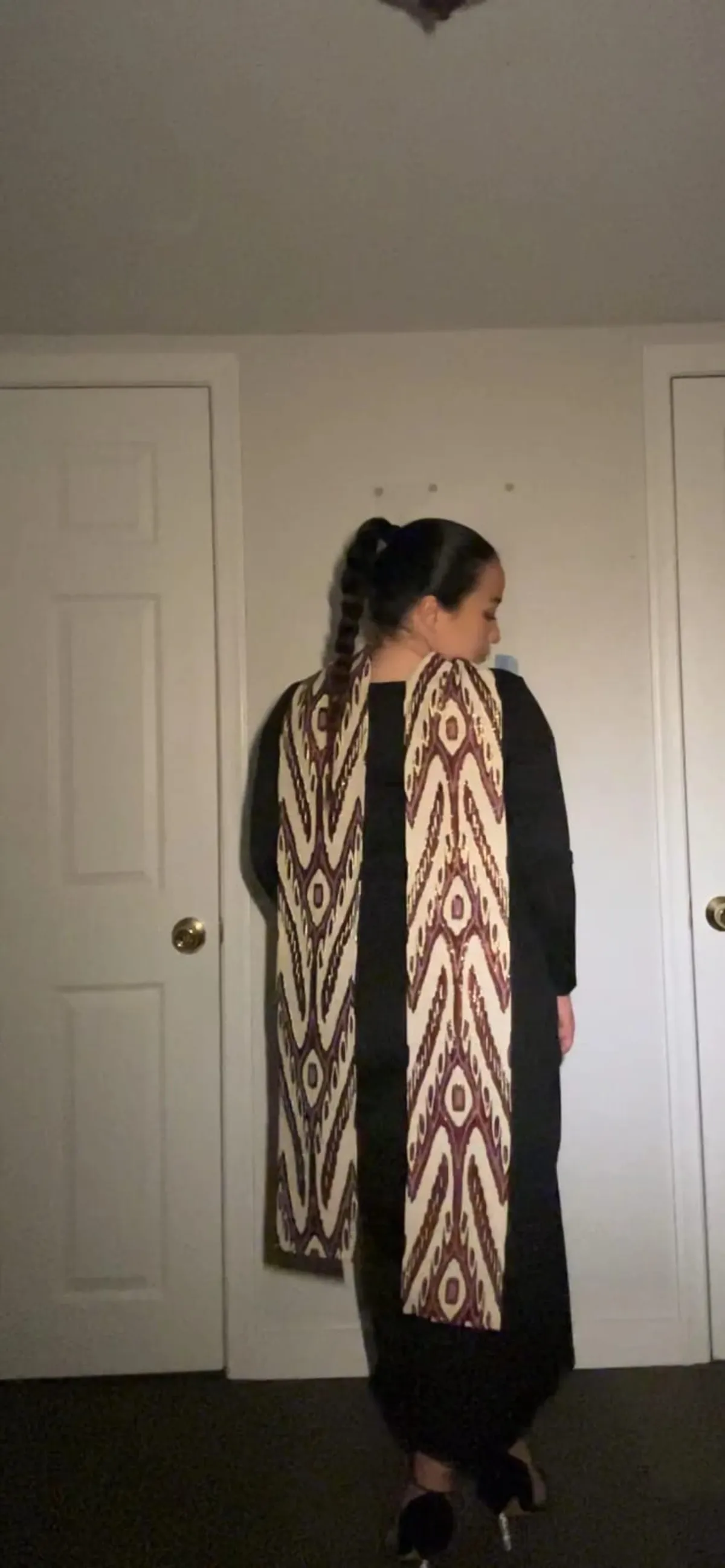 Atlas ikat neck scarf worn draped over the shoulders, back view